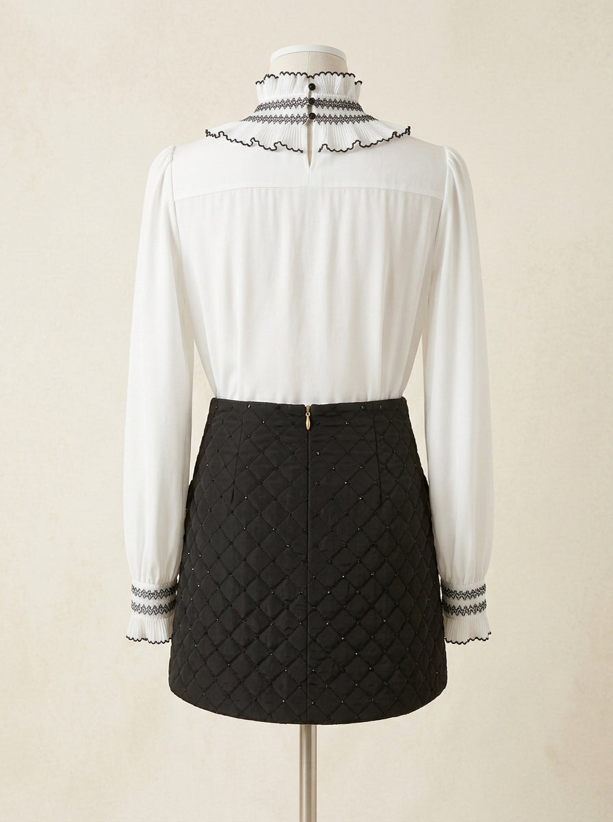 Falda negra acolchada con lentejuelas
