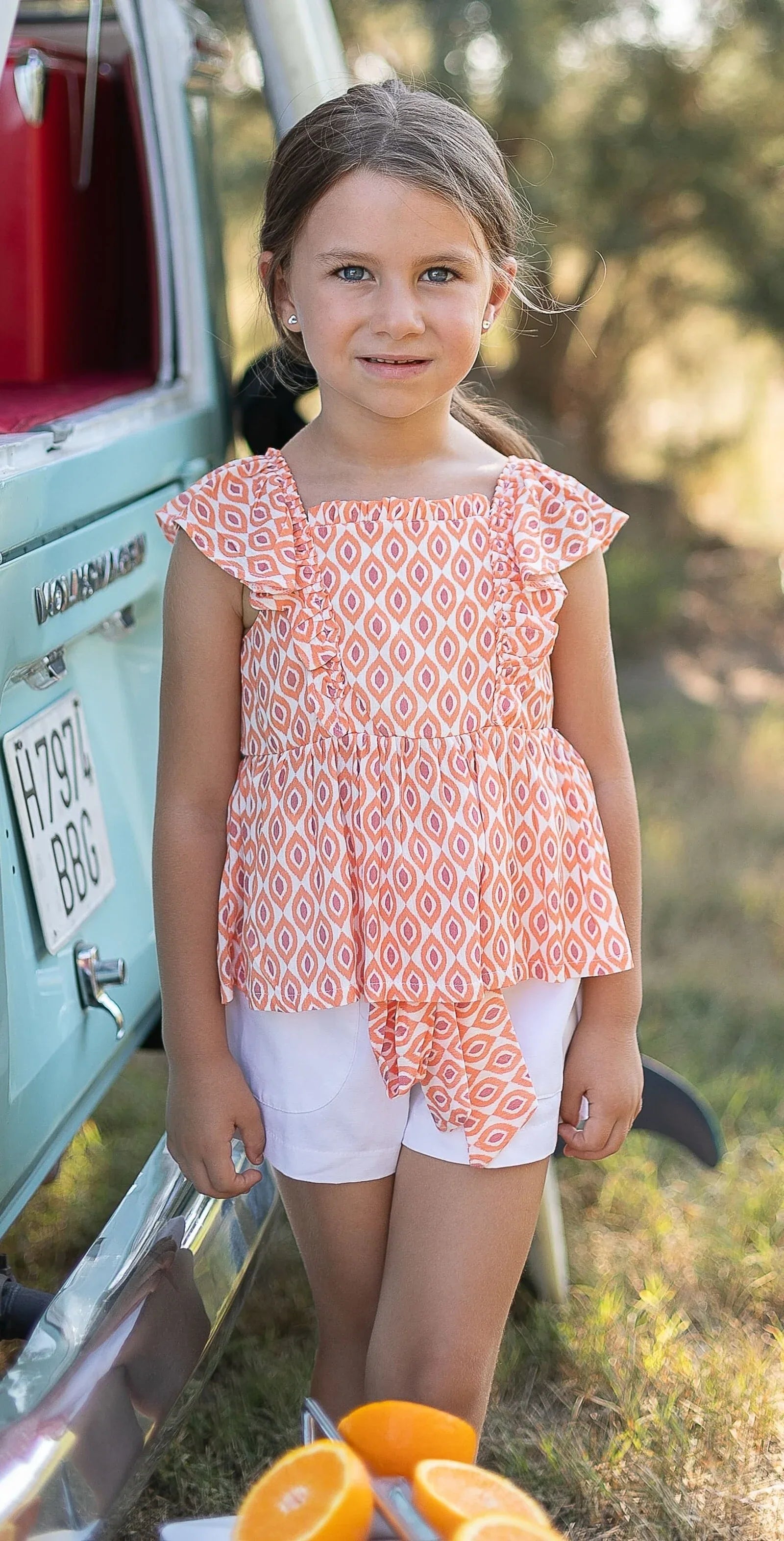 Conjunto blusa estampada naranja y short blanco - PARDALETS