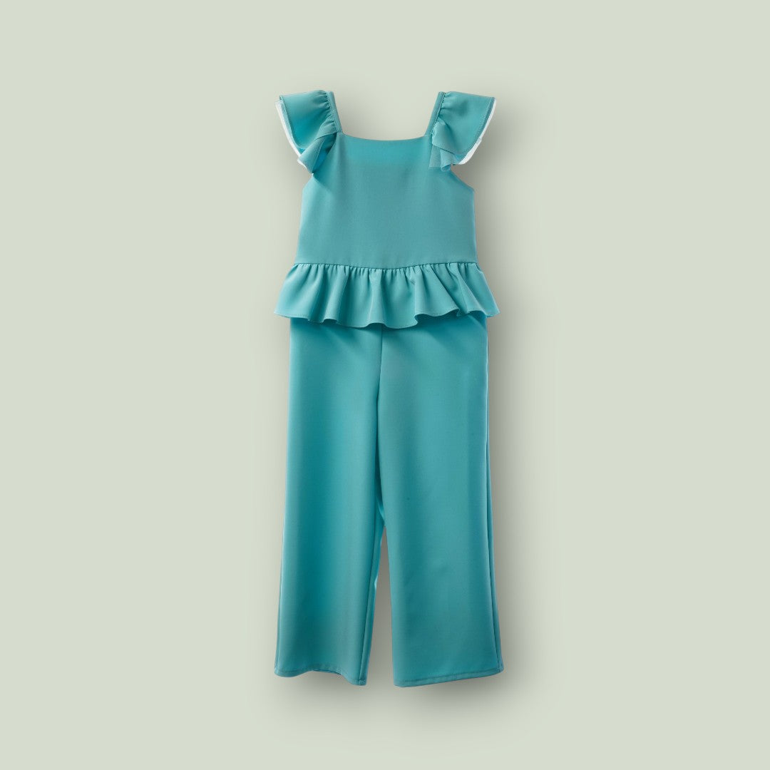 Mono verde esmeralda con volante en la cintura y lazo en la espalda