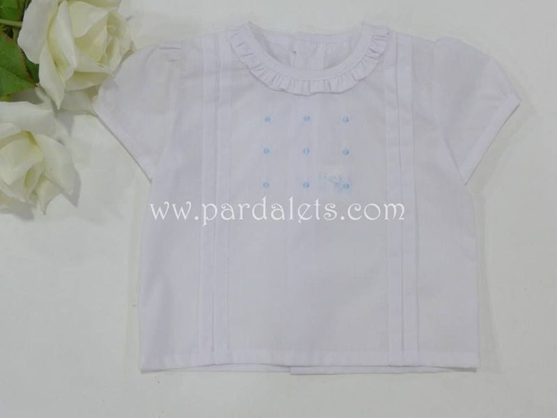 Camisa blanca cuello volante y bodoques
