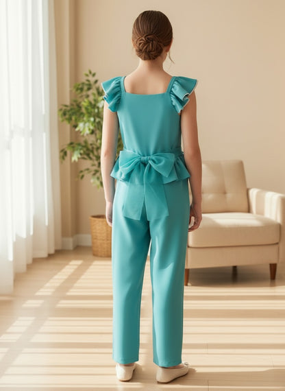 Mono verde esmeralda con volante en la cintura y lazo en la espalda