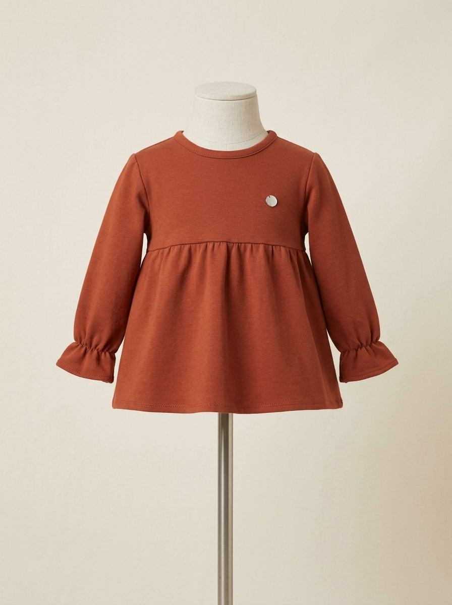 Sudadera color terracota con lazito trasero