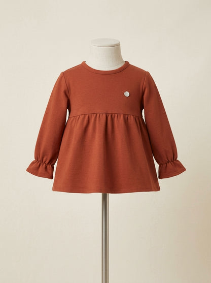 Sudadera color terracota con lazito trasero