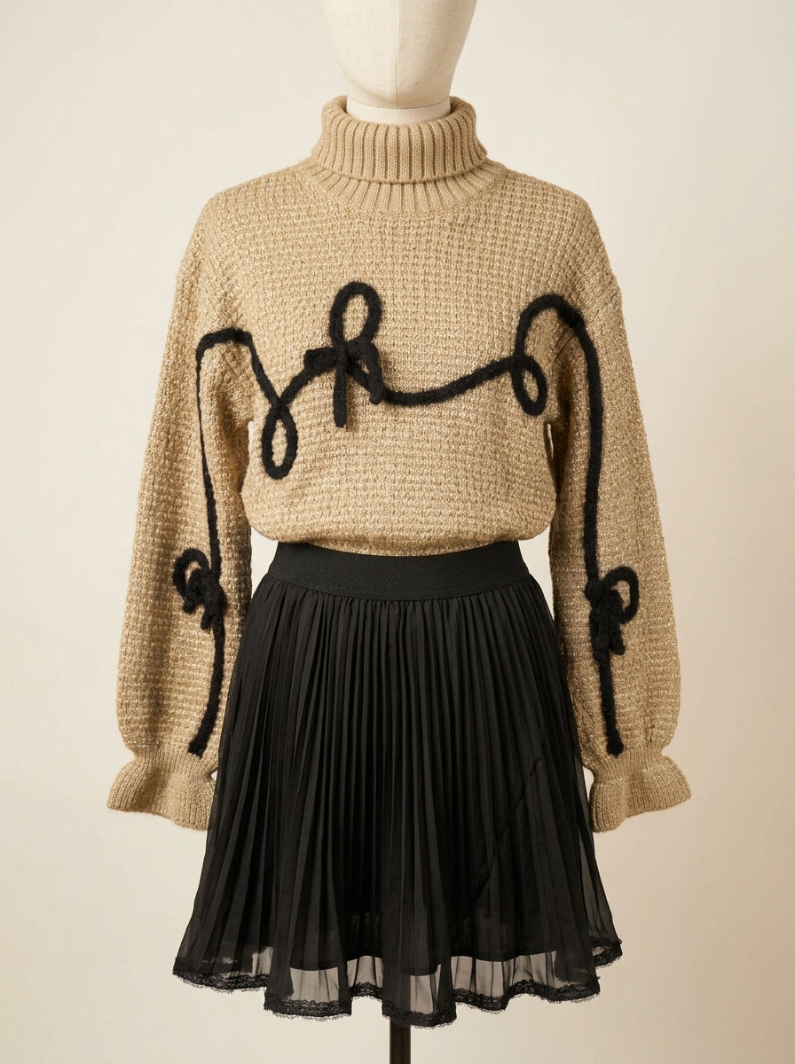 Conjunto jersey marrón con detalles negros y falda plisada negra