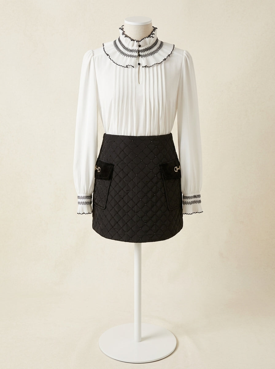 Falda negra acolchada con lentejuelas