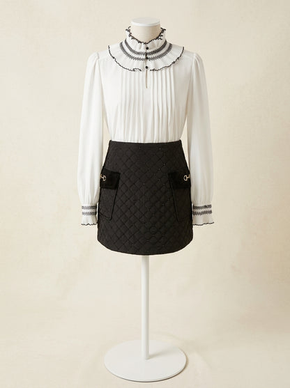 Falda negra acolchada con lentejuelas