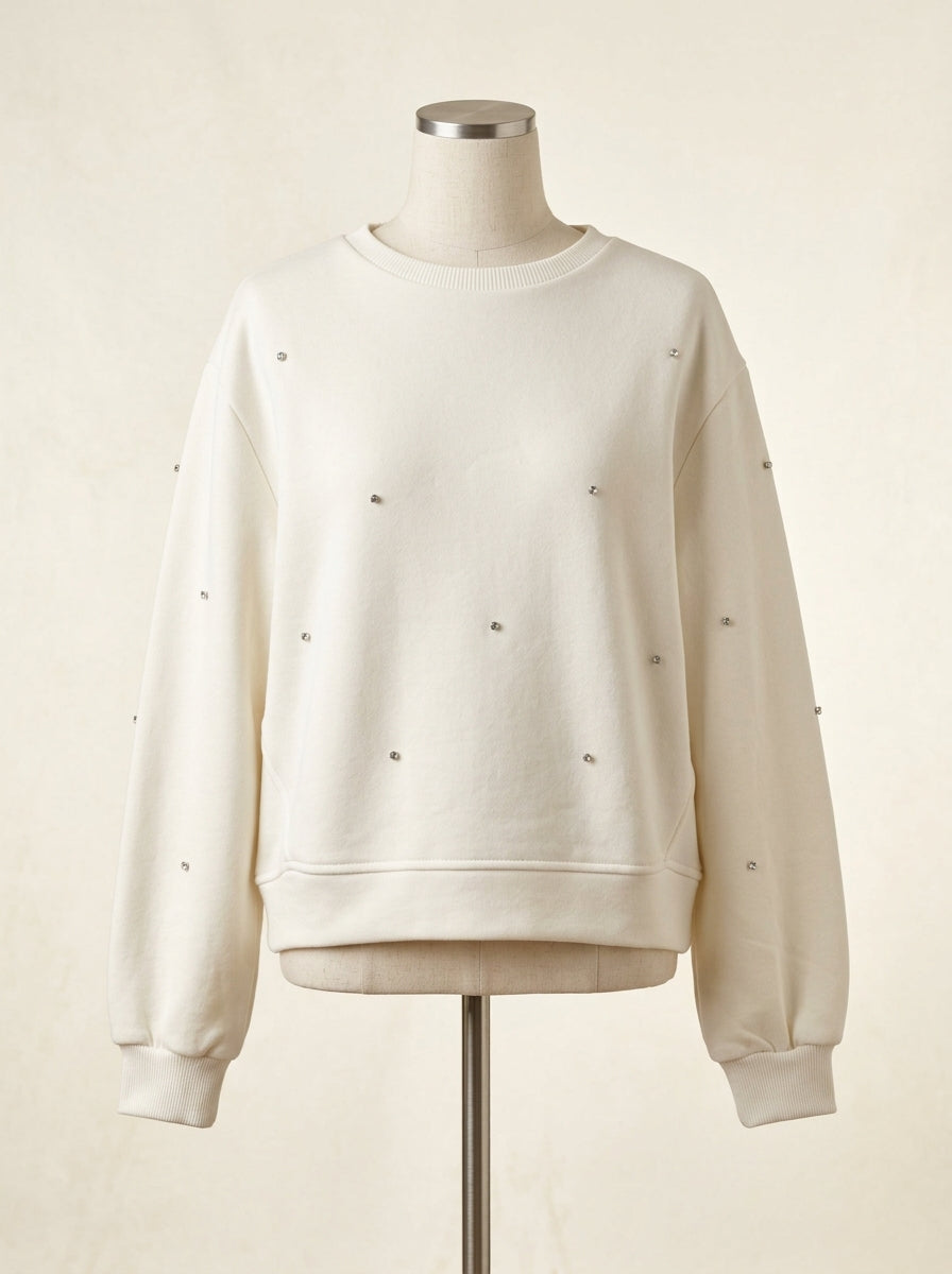 Sudadera color crudo con apliques brillantes