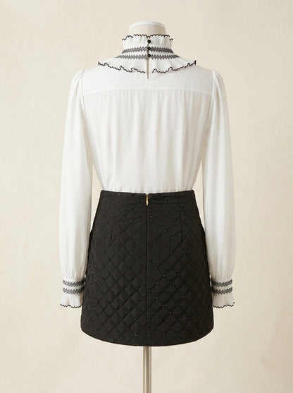 Falda negra acolchada con lentejuelas